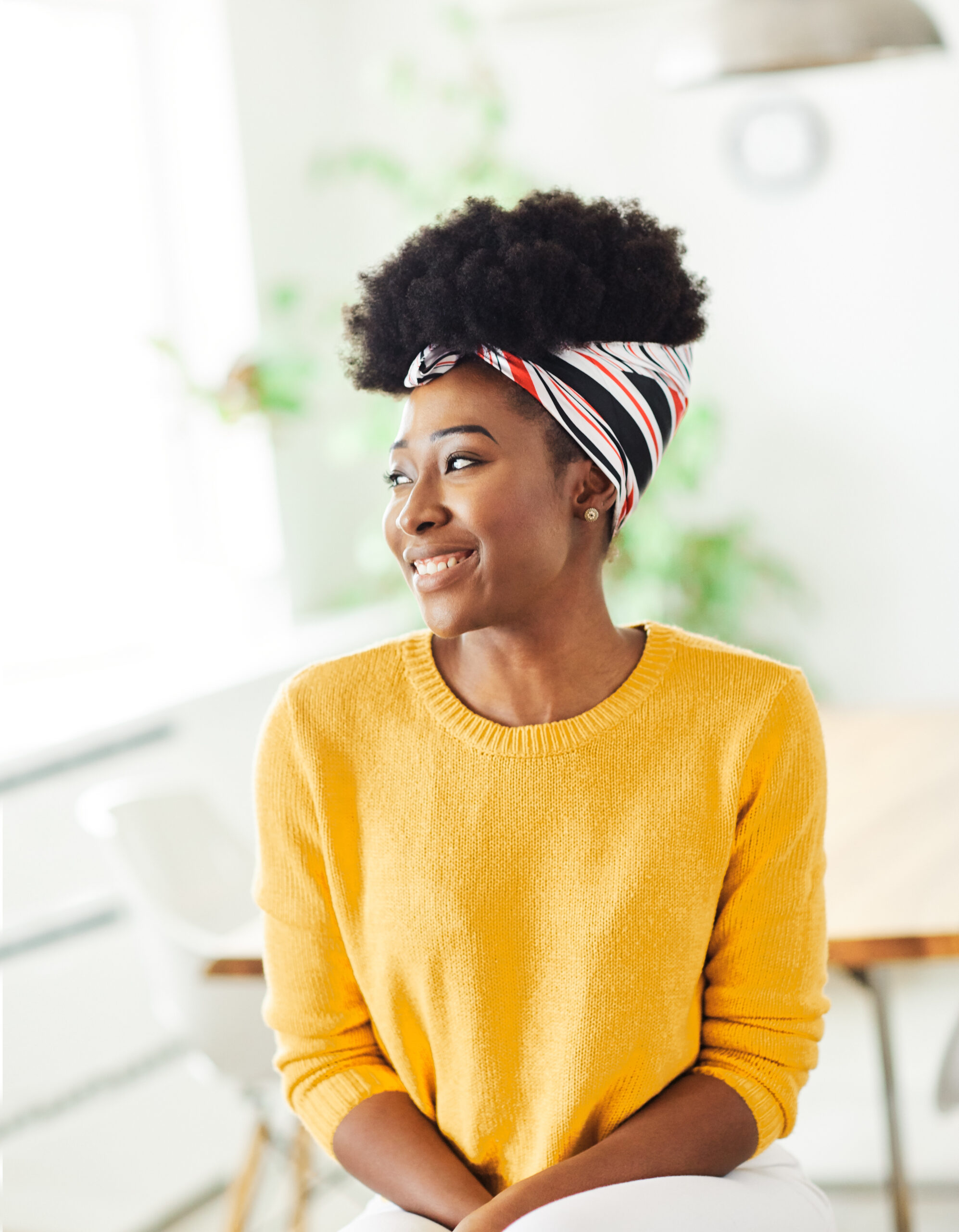 Attractive african american business woman in a modern office or a student in a classroom