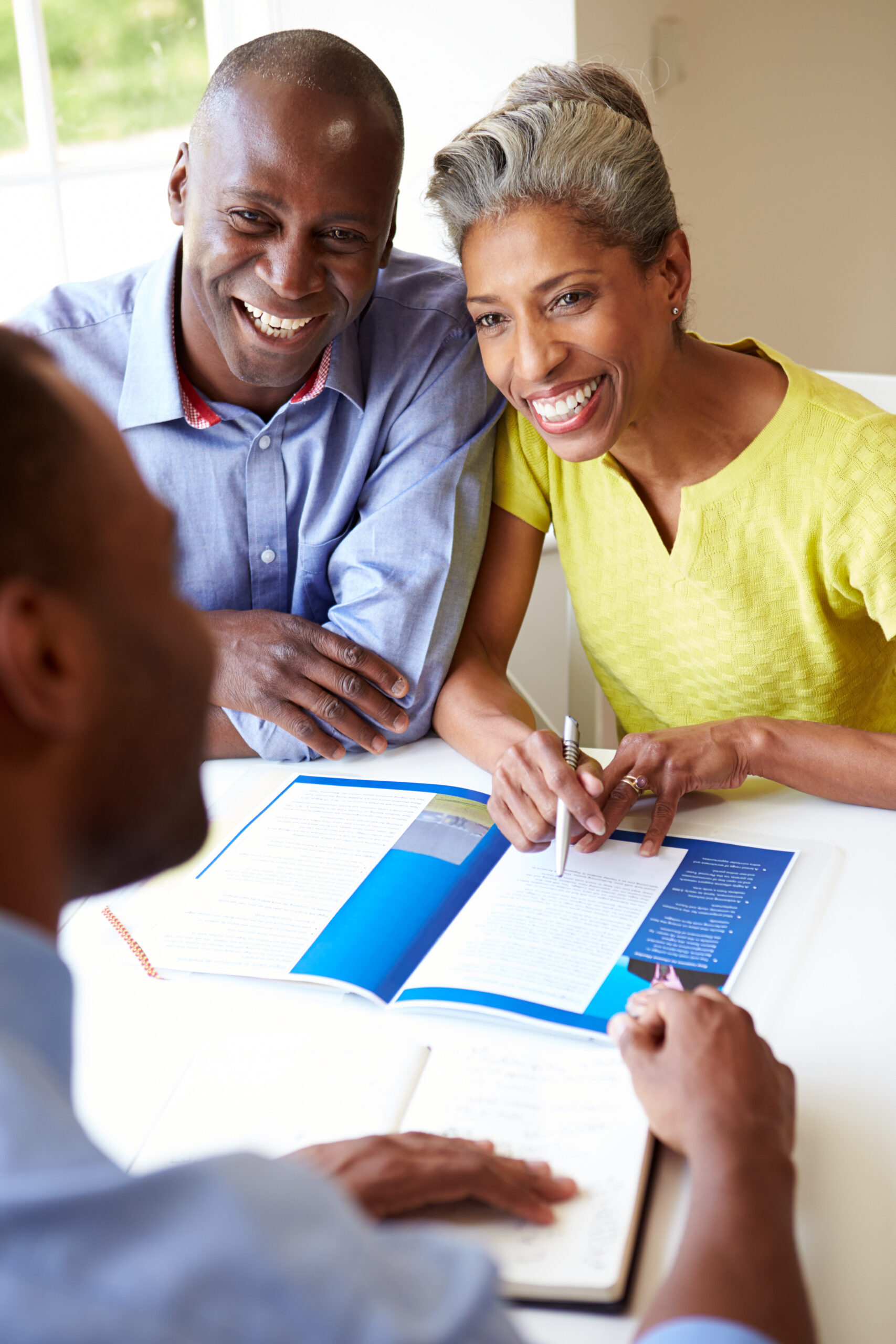 Mature Black Couple Meeting With Financial Advisor At Home